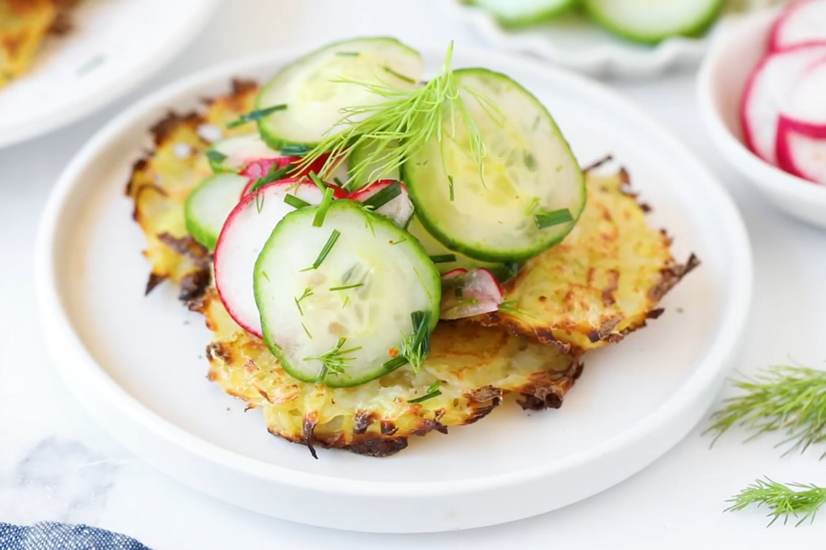 Potato pancakes with fresh cucumber and radish salad